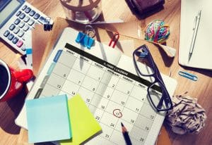 organizing appointments on a calendar with post it
