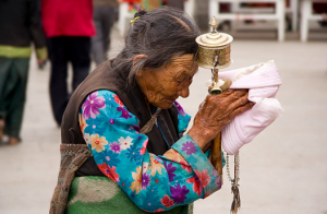 Old Tibetan Woman Praying