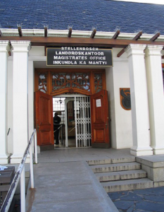 Trilingual government building sign in Afrikaans, English and Xhosa