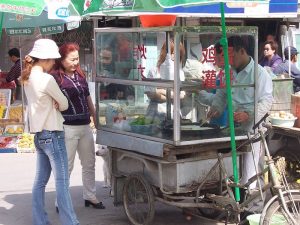 Image credit: China - Beijing 19 - our favorite breakfast stall taken by McKay Savage under Public Domain.