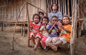 suku jahai children sitting with an elder