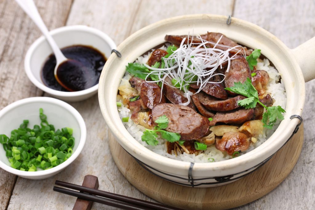 cantonese food, Chinese sausage and chicken with rice in clay pot