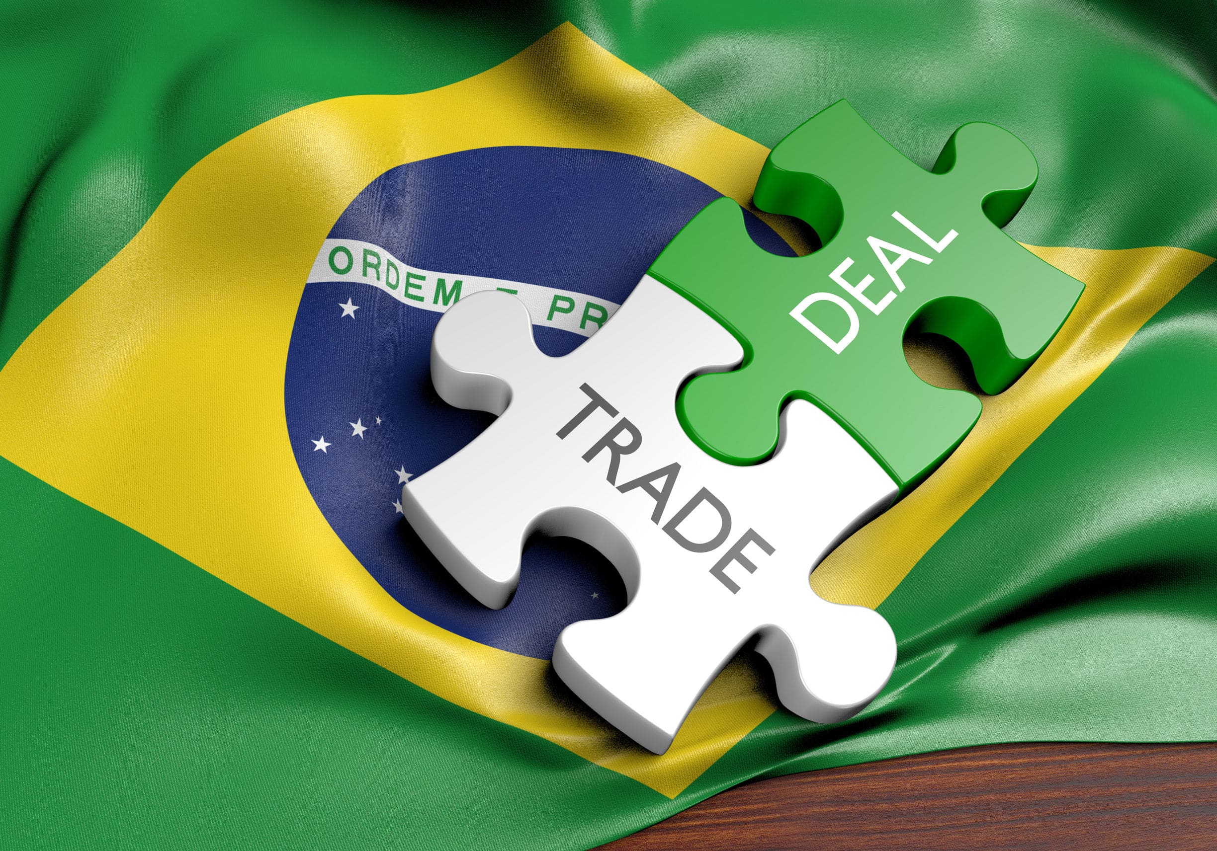 trade and deal puzzle pieces over a brazilian flag