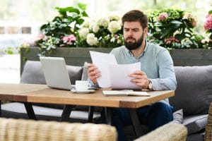 digital nomad working on remote jobs in a cafe