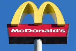 McDonald's golden arches against the blue sky
