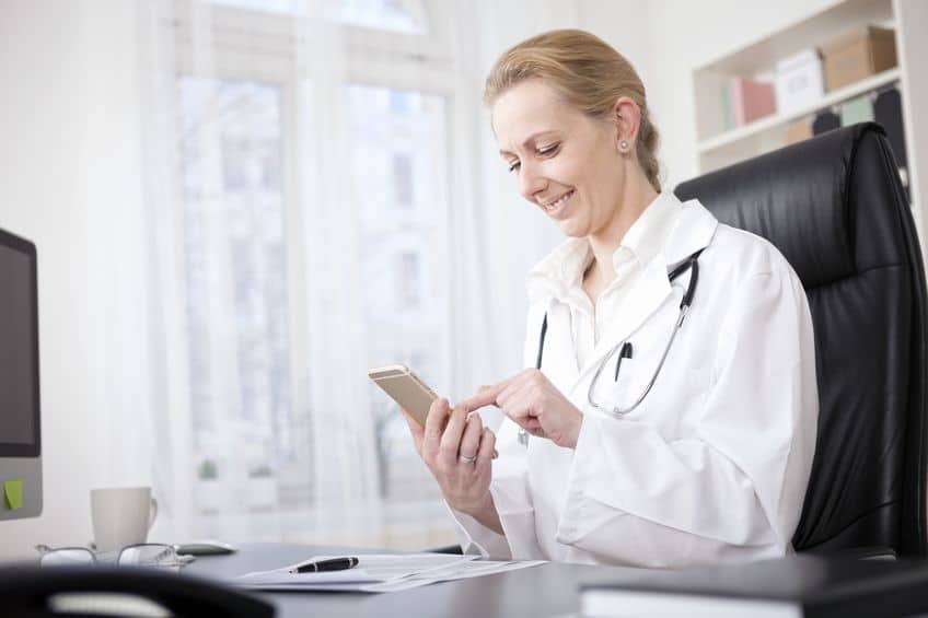 female doctor using the DayInterpreting app to book an interpreter for a patient