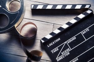 film translations - clapper and film reel
