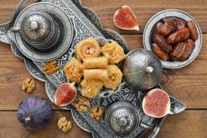 coffee with baklava served on a metal oriental tray