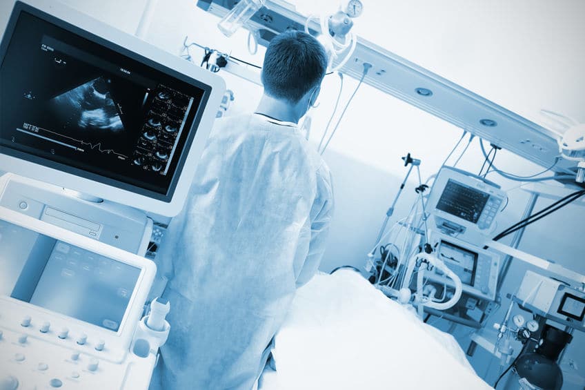 doctor checking advanced life support system used on by his patient