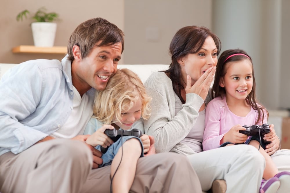 family playing a video game for bonding moments