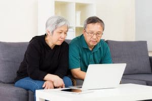asian-couple-buying-online