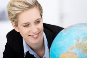 close-up-of-woman-looking-at-a-globe